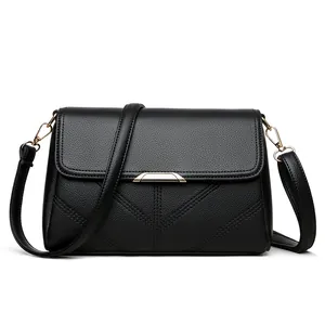 Chic black litchi leather crossbody bag with V-quilted flap and gold metal buckle