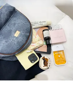 Detailed internal view showing large capacity storage in blue floral denim backpack