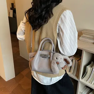 Gray-purple leather bucket bag with silver twist lock and cute bunny pendant charm