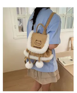 Side view of khaki corduroy backpack with white plush trim and cute cat motif