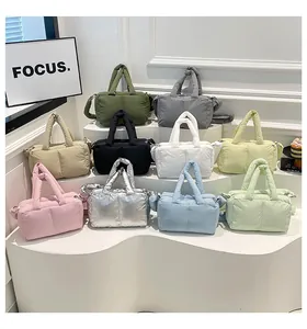 Multiple color options of quilted tote bags displayed in a minimalist tiered layout