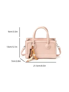 Sac à main baguette rose avec gland en perles et bandoulière amovible dimensions