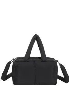 Modern black puffy tote bag with quilted padding and adjustable shoulder strap
