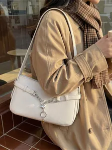 Chic white baguette shoulder bag with silver heart chain accessory and litchi texture PU leather