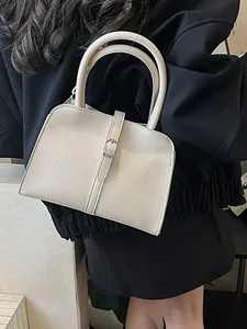 Minimalist cream beige leather handbag with metal buckle and arched handles for women