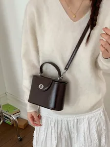 Elegant dark brown box bag with shiny PU leather finish and silver metallic rotary lock