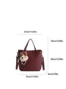 Dunkelrote Leder-Eimertasche mit Maßen 21x20x6cm und einem Plüschbär-Anhänger