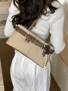 Retro khaki canvas Boston bag with brown leather straps and unique chocolate charm