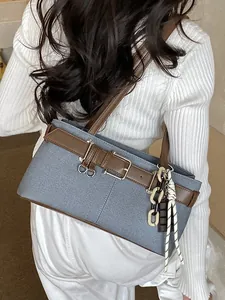 Retro denim Boston shoulder bag with brown leather trim and decorative chain tassels
