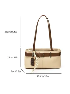 Beige canvas Boston bag with brown leather straps and chocolate pendant decoration