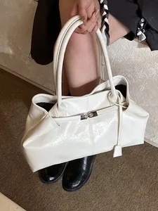 White vintage glossy patent leather tote bag with silver buckle and double handles