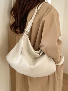 Creamy white oversized leather hobo bag with knotted strap and silver logo detail