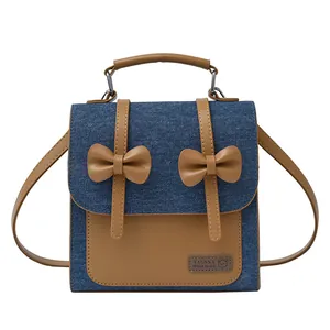 Retro denim and brown leather handbag with butterfly bows and adjustable strap