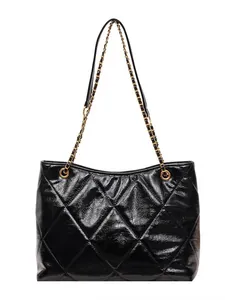 Chic black quilted tote bag with gold chain strap and glossy finish for stylish commuting