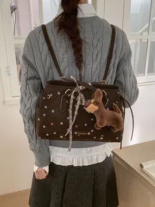 Brown star pattern tote backpack with plaid bow and plush dog charm in college style