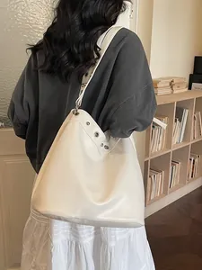 Minimalist cream white large capacity tote bag with stylish silver eyelets and smooth leather