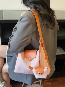 Twee-in-één draagtas van roze canvas en oranje leer met klein ophangzakje