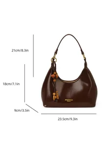 Brown leather dumpling bag with wooden beads and dimensions shown on white background