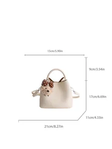Beige minimalist bucket bag with cute plush charm and detailed size measurements