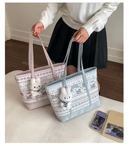 Close-up of pastel tote bags featuring rabbit plush charms and cute horse patterns