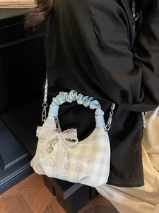 Light blue checkered crescent handbag with lace bows and pearl chain detail