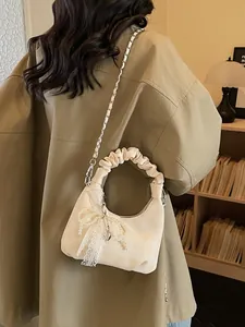 Chic pleated off-white corduroy dumpling bag with pearl bow and gold chain strap
