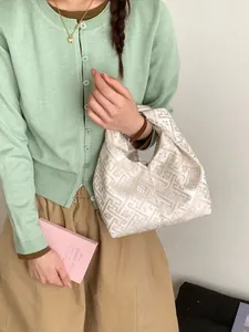 Sac à main nœud crème chic avec motif jacquard géométrique doré pour femme