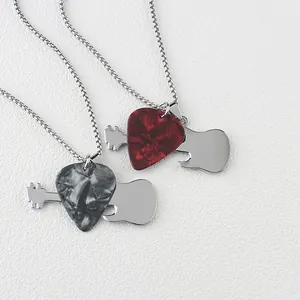 Detail view of red and black marble guitar pick pendants on stainless steel necklaces