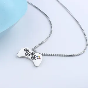 Close-up of silver game controller pendant with colorful buttons and metal chain