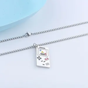 Macro view of stainless steel game controller necklace showing detailed colorful screen