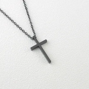 Minimalist matte black titanium cross pendant with matching fine chain link necklace
