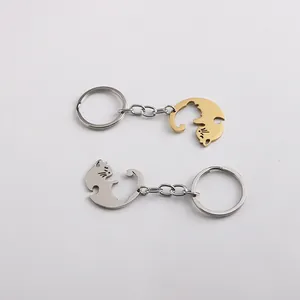 Polished gold and silver cat-shaped keychains for couples with interlocking puzzle design