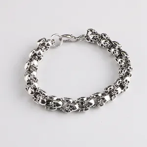 Close-up of gothic punk skull link bracelet in silver metal with lobster clasp