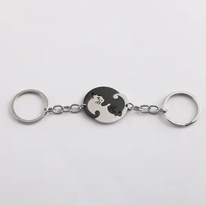 Cat couple keychain set in black and silver stainless steel with puzzle yin yang design