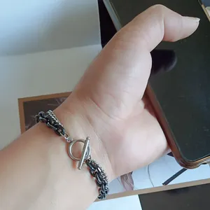 Detail of double-layer black and silver stainless steel chain bracelet with OT toggle clasp