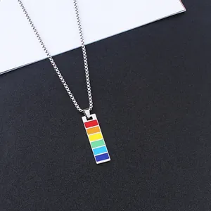 Detail of a rectangular rainbow enamel pendant on a silver stainless steel box chain