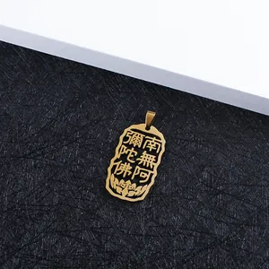 Macro shot of gold hollow Buddhist sutra pendant with lotus pattern and fine metal texture