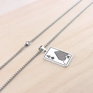 Detail of Ace of Spades poker card pendant on a stainless steel square box chain