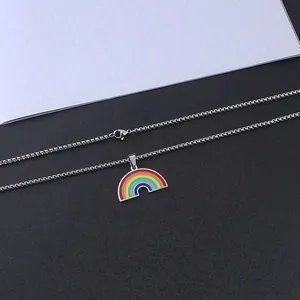 Detailed view of a rainbow arch pendant with a silver bead chain and lobster clasp
