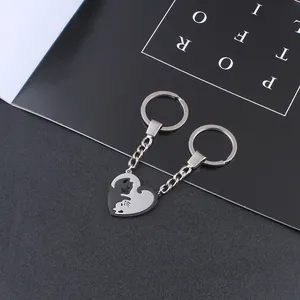 Matching cat couple keychains with interlocking heart design in durable stainless steel