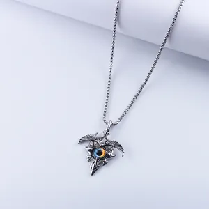 Gothic eagle pendant necklace with blue evil eye detail on a vintage silver chain