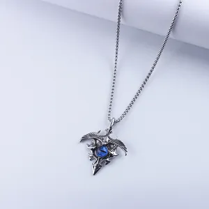 Gothic eagle pendant necklace with blue evil eye orb on vintage silver chain