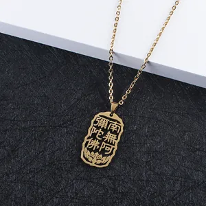 Detailed view of hollow Namo Amituabha pendant in gold stainless steel with lotus motif