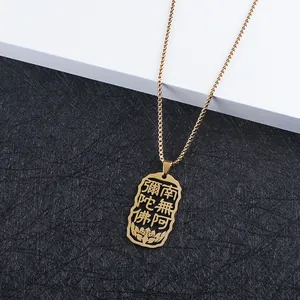 Macro view of golden hollowed Buddhist pendant with lotus detail and square box chain