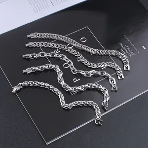 Detail of five different stainless steel chain bracelets with sturdy industrial clasps