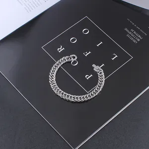 Detailed view of silver Cuban link chain bracelet made of polished stainless steel