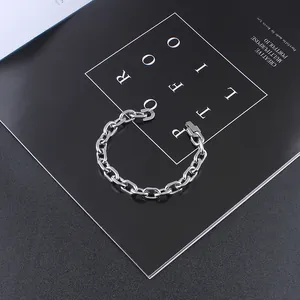 Close-up of industrial silver stainless steel chain bracelet with secure buckle clasp