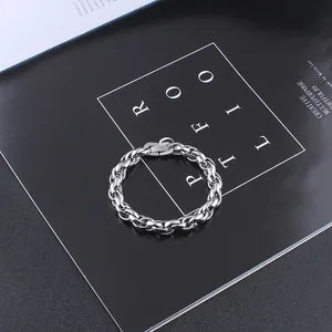 Macro detail of silver stainless steel thick link chain bracelet with rectangle clasp