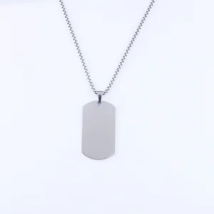 Detailed close-up of a polished rectangular stainless steel military dog tag pendant