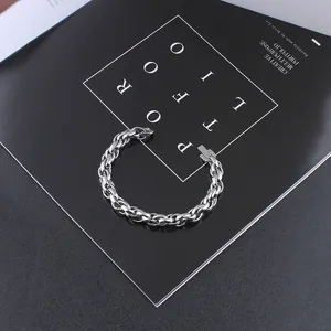 Detailed view of silver titanium steel curb chain bracelet with industrial clasp mechanism